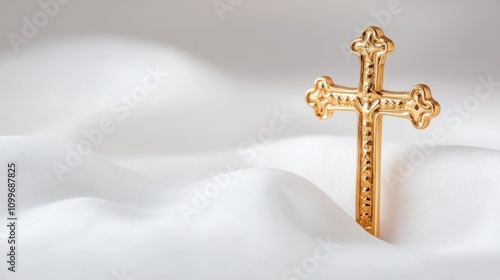 religious symbolism, a delicate crucifix on a soft white cloth stands out with intricate details against a serene background photo