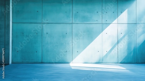 Soft blue cement and concrete wall with subtle texture and light ray creating an inviting horizontal banner background.