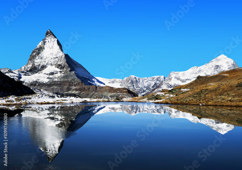 Switzerland, Swiss Alps. Mount Matterhorn and Stellisee lake. Hiking trail view.  photo