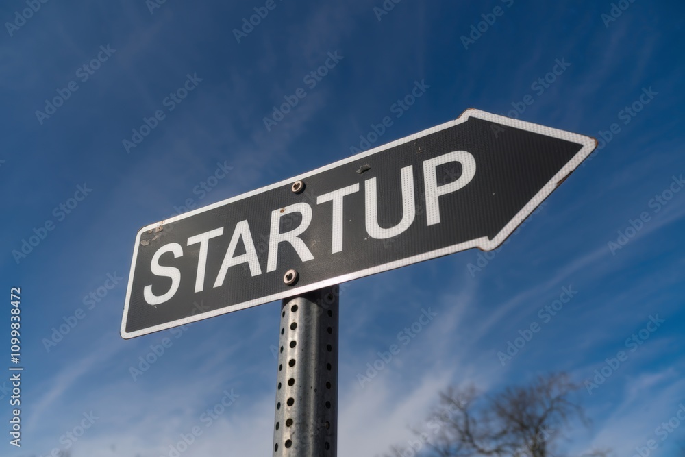 Obraz premium Startup word written on a signboard, business and work career concept.