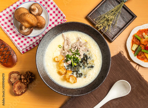 Obraz na plátně Century Egg and Lean Meat Porridge with mushroom,chopsticks and spoon served in