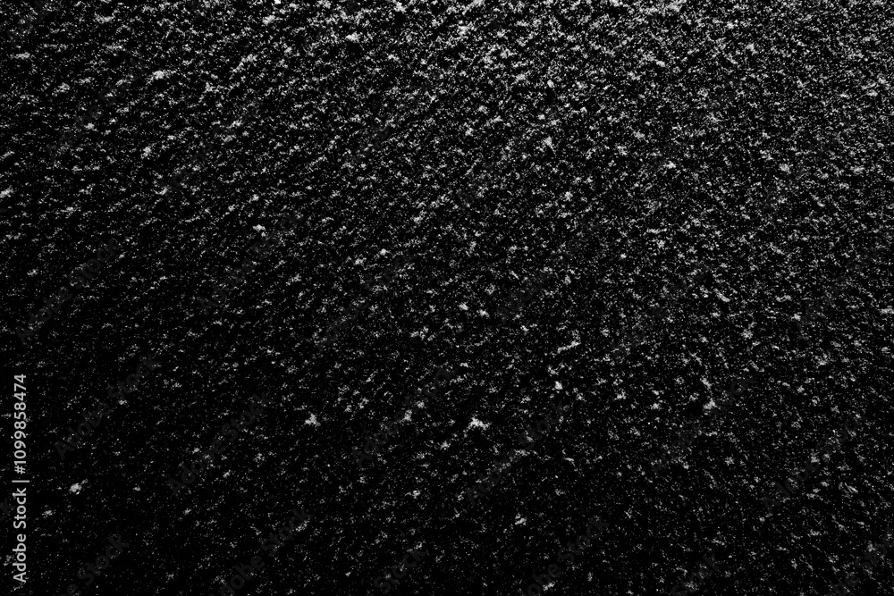 Naklejka premium Natural white snow on a black background