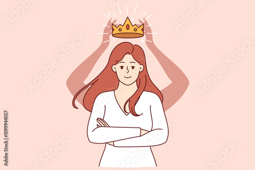 Self-confident woman with crown above head stands with arms crossed in front of chest and looks at screen smiling. Self-confident girl rejoices at gold award for achieving success in career