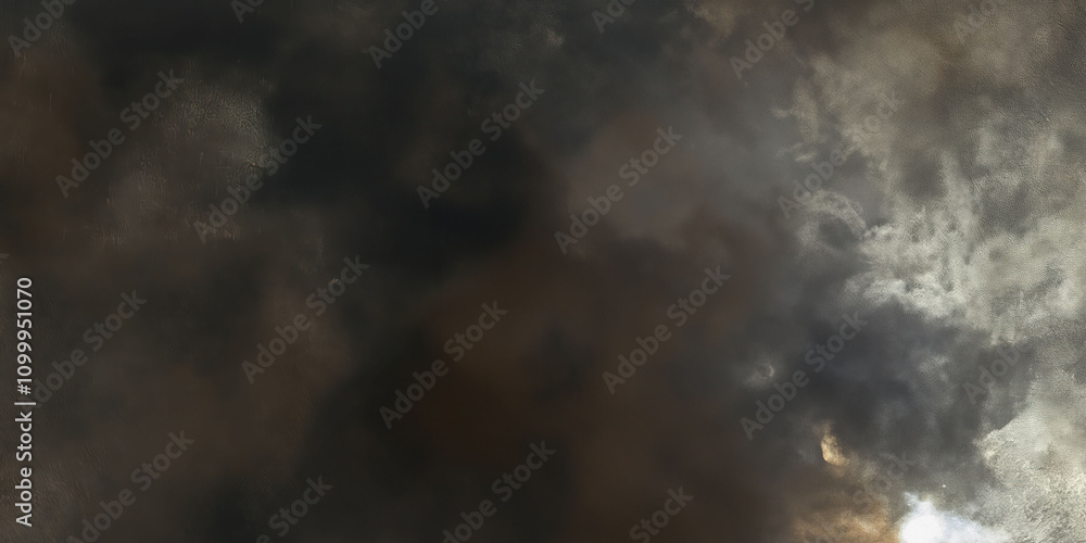 Obraz premium Dramatic dark sky with heavy clouds and subtle light patches