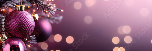 Elegant purple holiday ornaments on festive tree with bokeh lights