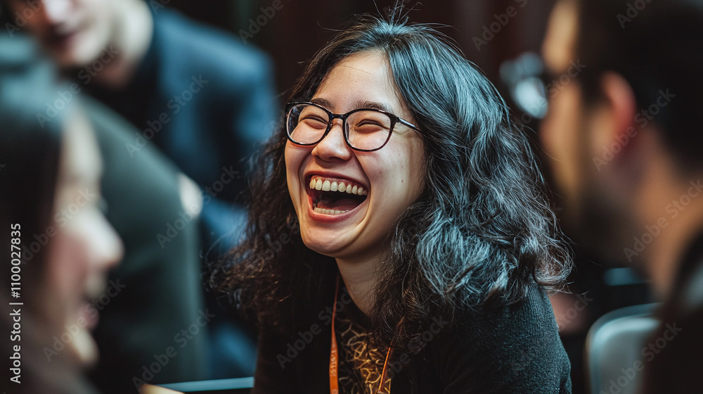 Fototapeta premium A candid shot of attendees laughing and enjoying a light moment during a break
