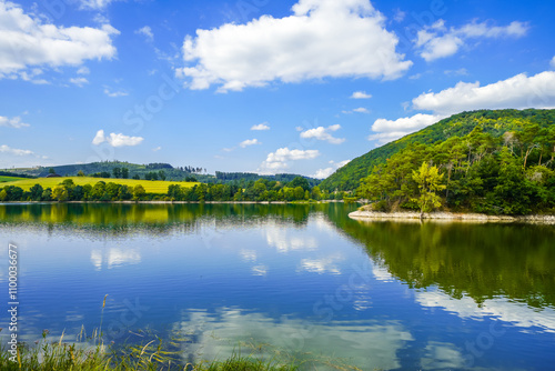 View of Lake Diemelsee and the surrounding landscape. Idyllic nature at the reservoir in Sauerland.
