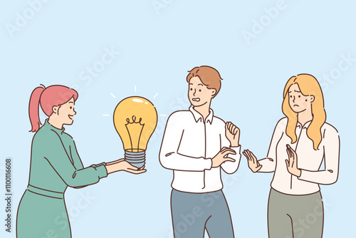 Office employees are critical of idea of female colleague holding light bulb in hands