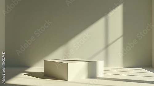 A minimalist interior with a white pedestal in soft light, creating a serene atmosphere.