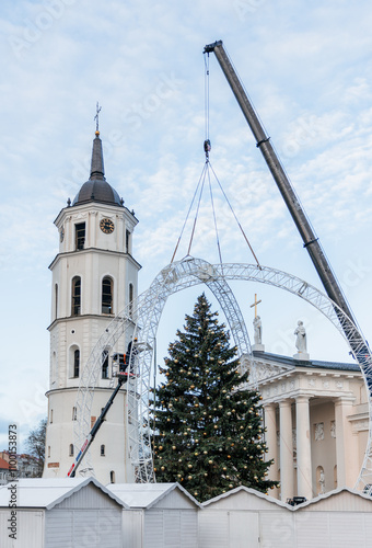 Vilnius Cathedral in Old Town with a Large Christmas Tree Under Construction, Crane in Action, Christmas Decorations, Lithuania, Lietuva, preparation photo