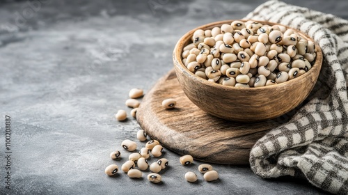 Fresh Black-eyed Peas in Wooden Bowl on Rustic Surface with Soft Cloth, Perfect for Healthy Eating, Cooking, and Organic Food Photography photo