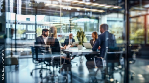 Professionals Convening in Glass-Walled Meeting Room photo