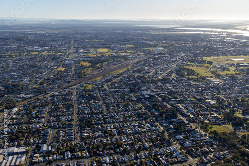 Aerial view of sprawling residential neighborhood with modern architecture and scenic roads, Adamstown Heights, Australia. photo