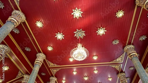 beautiful ceiling pattern in a Thai temple, The ceiling in the Thai temple is adorned with intricate carvings and vibrant murals