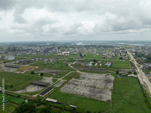 Aerial view of industrial refinery with storage tanks and greenery, Eleme, Nigeria. photo