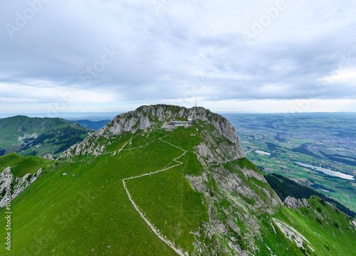 Aerial view of Stockhorn Mountain with a scenic hiking path under a cloudy sky, Erlenbach im Simmental, Switzerland. photo