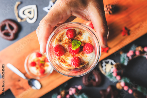 Obraz na płótnie Verrine of crushed speculoos, mascarpone and raspberries on a gray background decorated for Christmas w salonie