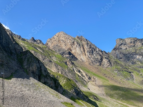 Rocky alpine peaks above Lake Melchsee or Melch Lake in the Uri Alps mountain massif, Kerns - Canton of Obwald, Switzerland (Kanton Obwalden, Schweiz) photo