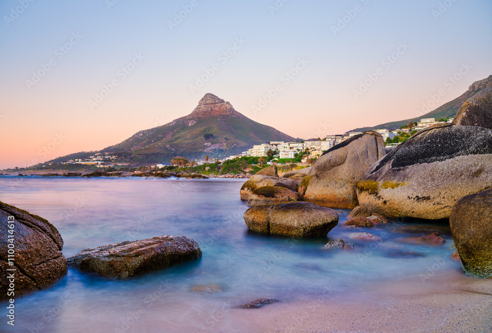 Sunset view of Lion's Head and Camps Bay from Beta Beach, Cape Town, South Africa