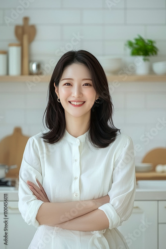 Asian female adult smiling in kitchen with shelf Free Download Asian female adult smiling in kitchen with shelf - GFXLoad
