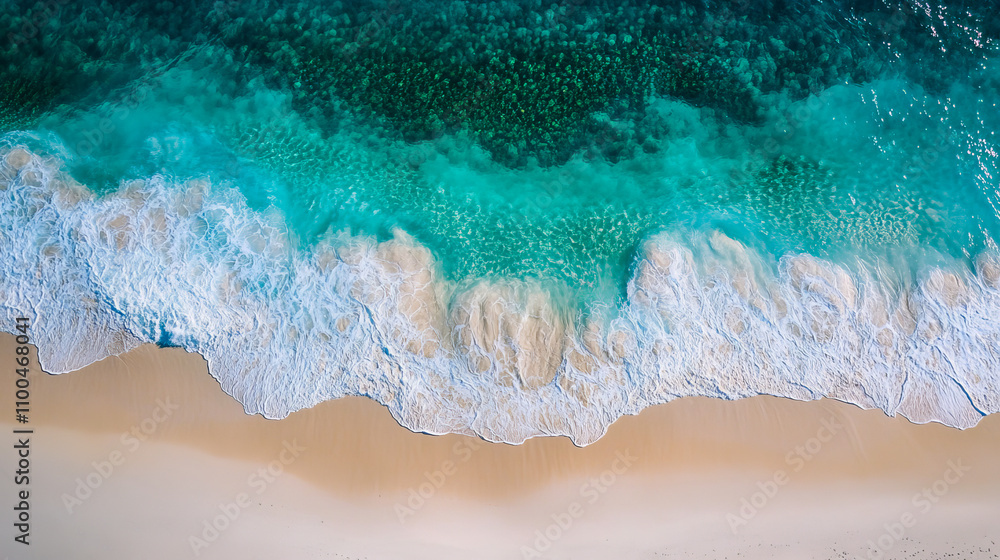 Aerial view of tropical ocean waves crashing on sandy shoreline Aerial view of tropical ocean waves crashing on sandy shoreline
