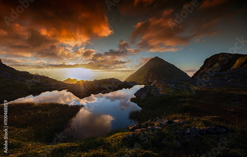 Lofoten is a chain of islands far north on the coast of Norway.  Lofoten is an absolutely incredible place. It's gorgeous and dramatic, with mountains growing straight out of the ice-cold waters . photo