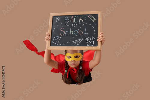 Happy schoolgirl dressed as...