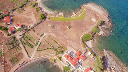 4k drone flying over footage (Ultra High Definition) of Xifias village. Beautiful summer scene of Peloponnese peninsula, Greece, Europe. Colorful morning seascape of Myrtoan Sea. photo