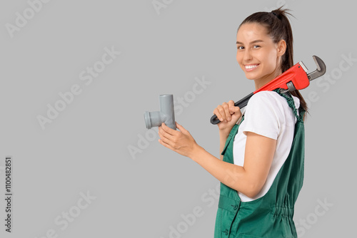 Female plumber with wrench ...