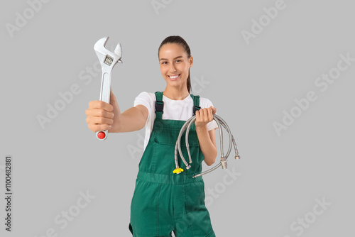 Female plumber with wrench ...