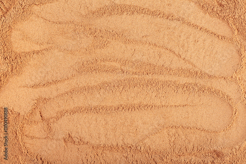 Incense - chandan or sandalwood powder pile as background, top view. photo