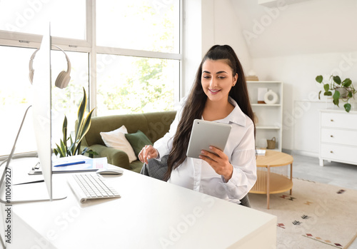 Pregnant businesswoman with...