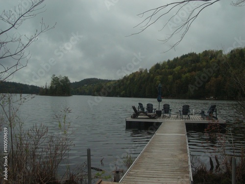 Lake view with gray clouds and fall mountains photo