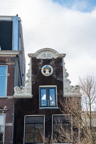 Roof hatches and gable windows of Amsterdam's buildings. Unique European architecture of Amsterdam, Netherlands.  photo