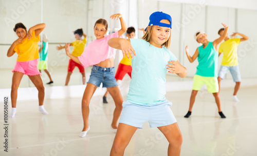 Dance studio - happy girls and boys in dance lesson photo