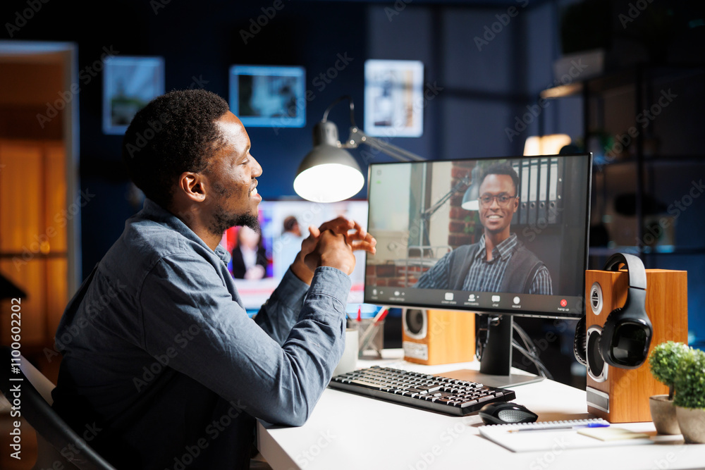 Fototapeta premium Student attending training course with expert on videocall, meeting with trainer online on class program. Young man learning about business administration and operations on telework webinar.