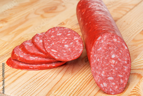 Sausage stick on wooden background. Pork beef sausage.