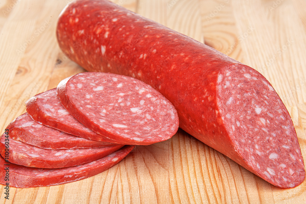 Sausage stick on wooden background. Pork beef sausage.