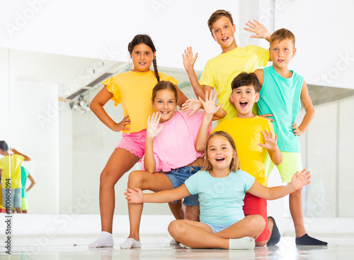 Happy emotional children posing at modern dance class photo