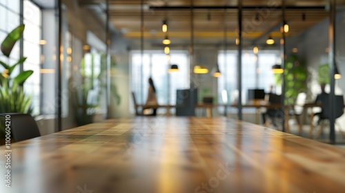Wallpaper Mural Modern office interior with a wooden table in focus, featuring plants and warm lighting, creating a productive work environment. Torontodigital.ca