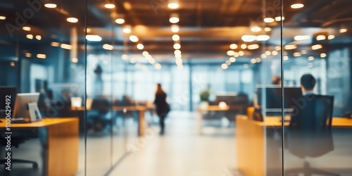 Wallpaper Mural Blurred office interior shows people working at desks. Modern office space with glass partitions. Workers likely focused on tasks. Contemporary office environment. Likely daytime. Open office plan. Torontodigital.ca