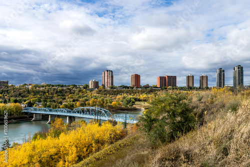 Edmonton cityscape with Dawson Bridge  and high rises building along LRT line on background in fall season