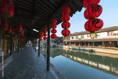 street corridor with lantern decoration along river photo