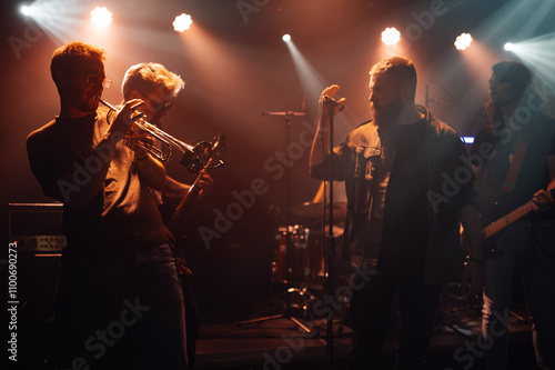 Sticker Musicians playing instruments and singing on stage during concert