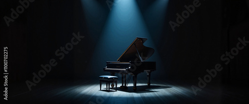 Grand piano in spotlight on dark stage, musical performance