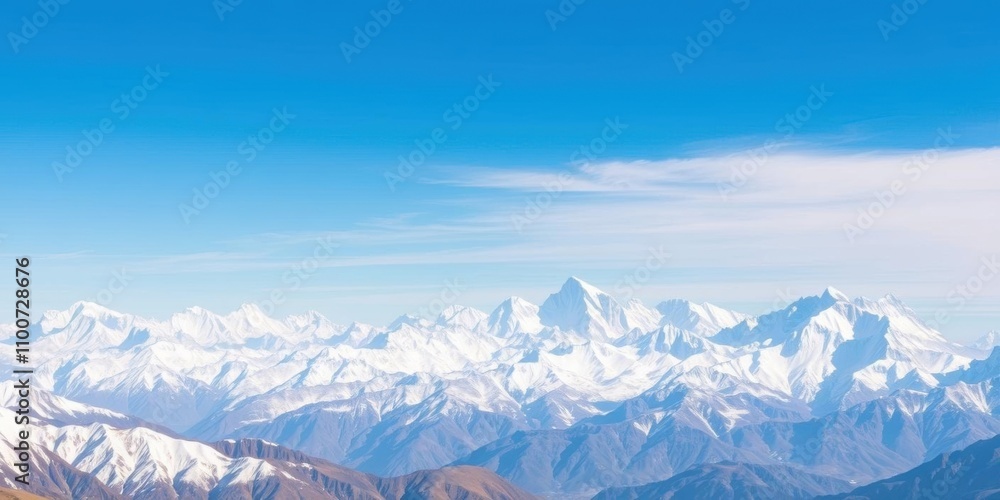 Fototapeta premium A breathtaking panoramic view of the snow-capped Nepal mountain range under a clear blue sky, showcasing towering peaks and dramatic valleys, scenic landscape, geography