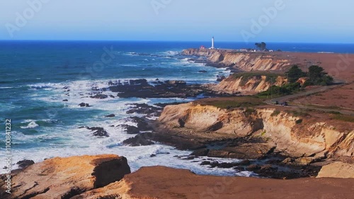 Point Arena Lighthouse Sea Lion Rocks Cove Racas California aerial drone Stornetta coastal Trail Mendocino coast sunny daytime morning afternoon blue sky waves vista point scenic view forward pan up photo