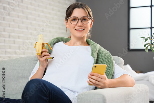 Young woman with mobile pho...