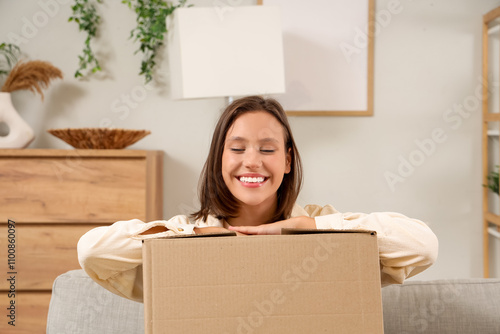 Smiling young woman with ca...