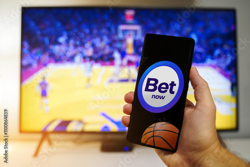 Valokuva Betting app on mobile phone, live match betting concept for basketball games